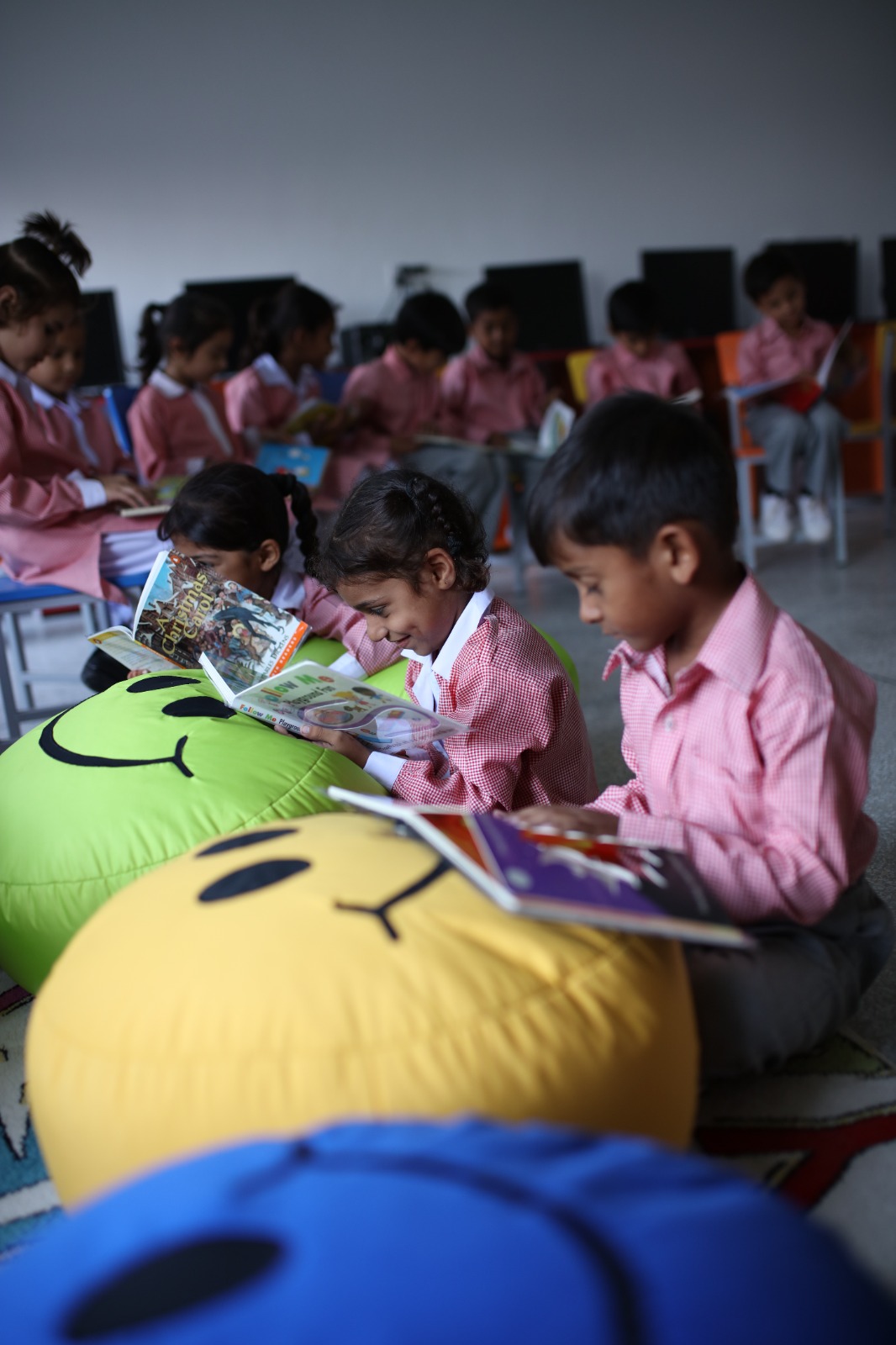 Students reading books in classroom